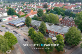 S&P | Titelbild - Achim | Faktor 16: Schickes Einkaufszentrum mit 6 Läden und 5 Wohneinheiten