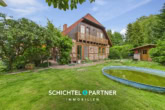 S&P | Seitenansicht - Aschwarden | Gepflegte Doppelhaushälfte mit Carport und weitläufigem Garten